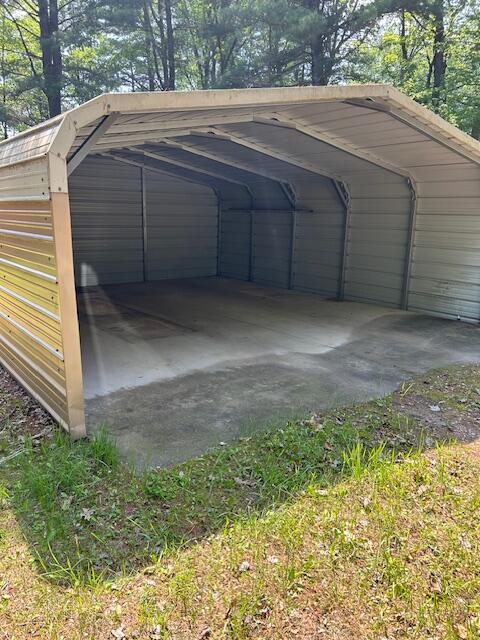 10773 Hamilton Rd, Irons, MI 49644 - view of outdoor structure with a detached carport