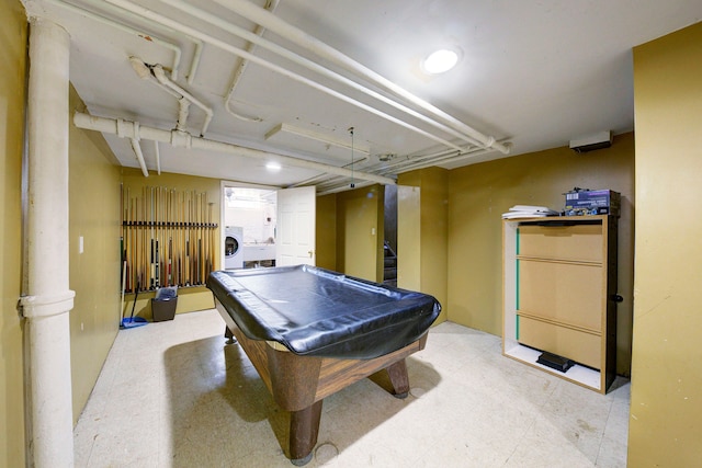 game room with light floors, washer / clothes dryer, and pool table