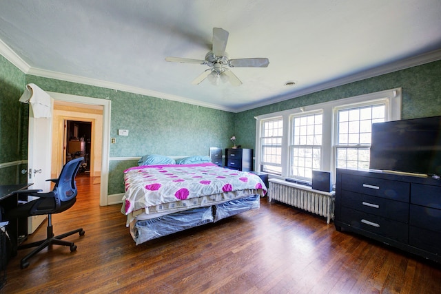 bedroom featuring wallpapered walls, multiple windows, and wood finished floors