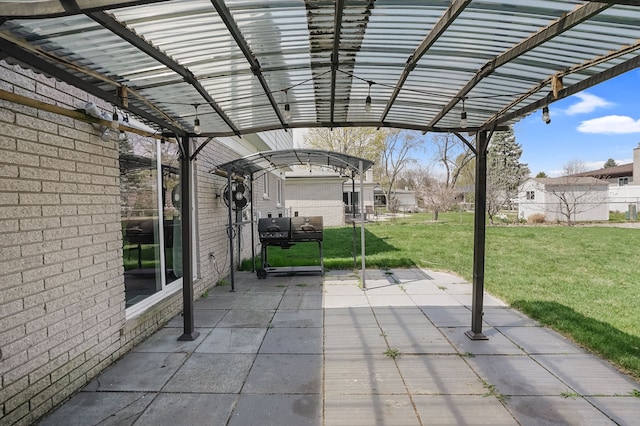 view of patio / terrace with a pergola and a grill