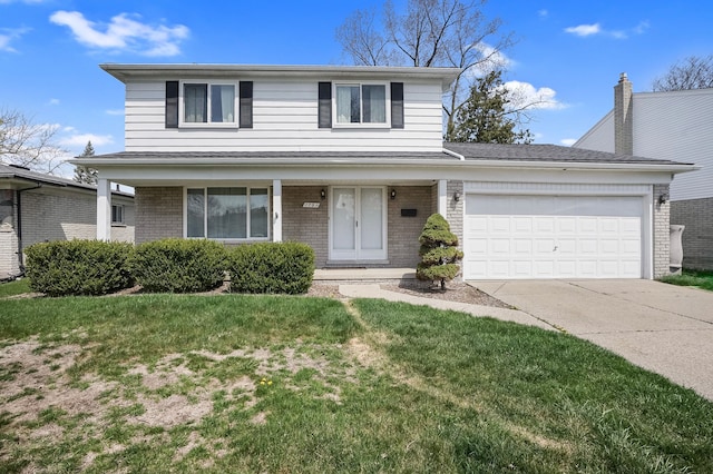 traditional-style home featuring brick siding, a front yard, driveway, and an attached garage
