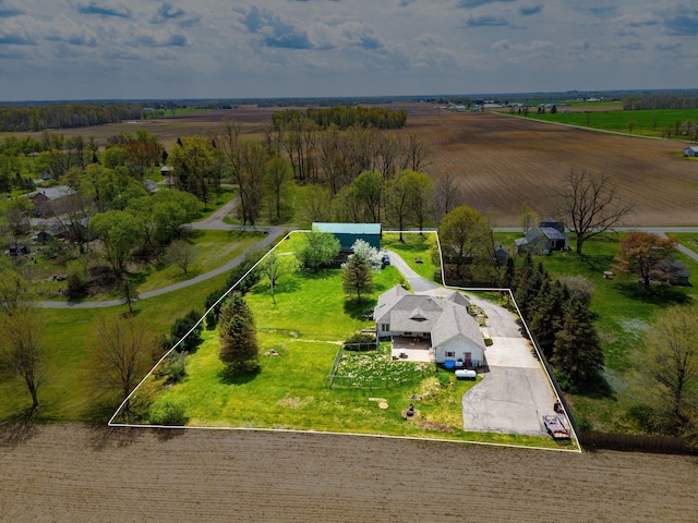 birds eye view of property with a rural view