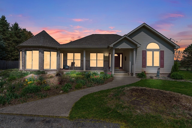 view of front of home featuring a porch and roof with shingles