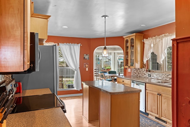 kitchen with a kitchen island, glass insert cabinets, black electric range, arched walkways, and dishwasher