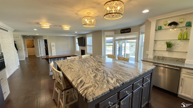 kitchen with light stone counters, stainless steel dishwasher, a chandelier, open floor plan, and recessed lighting