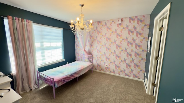 carpeted bedroom with baseboards, wallpapered walls, and a notable chandelier
