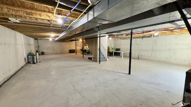 unfinished below grade area featuring stairway