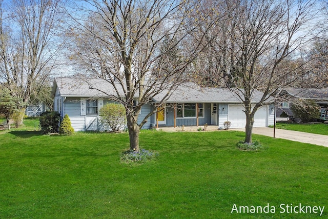 single story home featuring a front yard, concrete driveway, and a garage