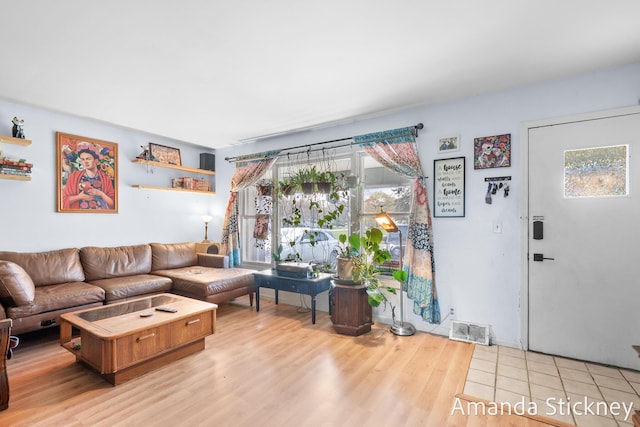 living area with visible vents and light wood-type flooring