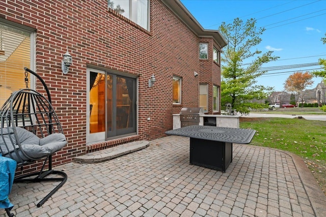 view of patio / terrace with a sink, a grill, and exterior kitchen
