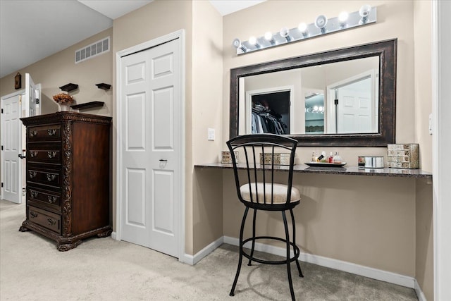 interior space featuring baseboards, carpet flooring, and visible vents