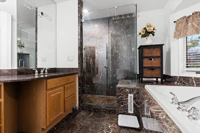 bathroom with vanity, marble finish floor, a garden tub, and a marble finish shower