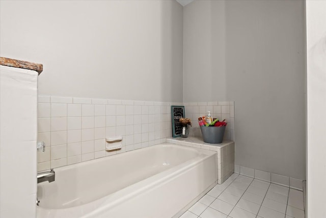 full bath featuring tile patterned floors and a garden tub