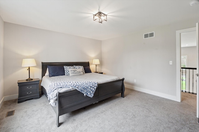 bedroom featuring carpet flooring, baseboards, and visible vents