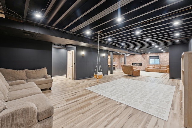 finished basement featuring wood finished floors
