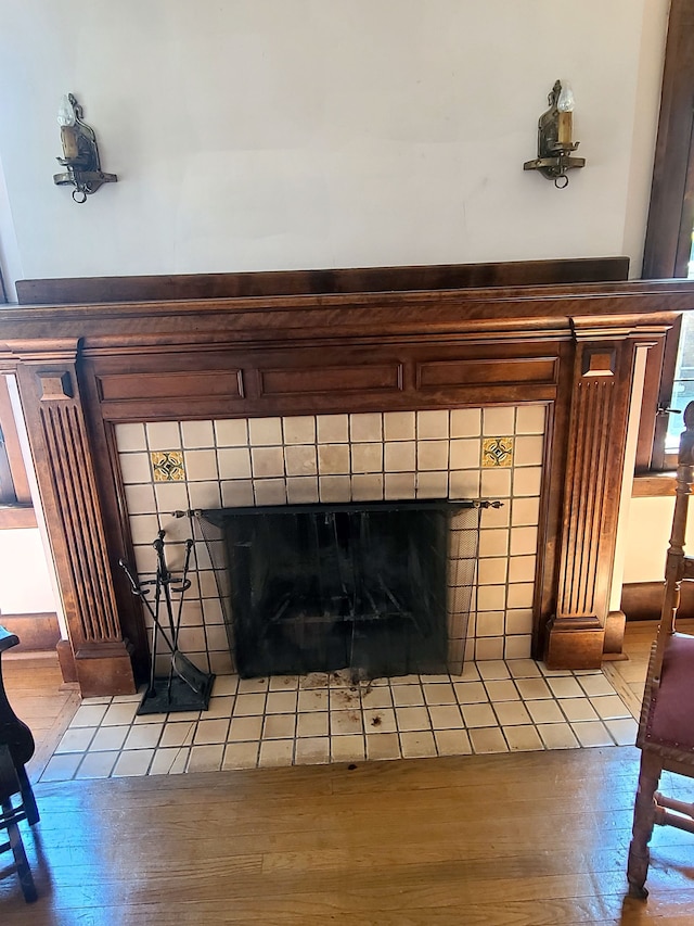 room details featuring a tile fireplace