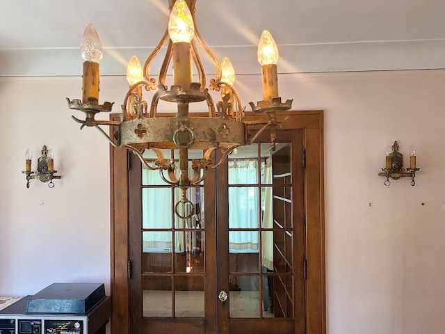 interior details featuring an inviting chandelier