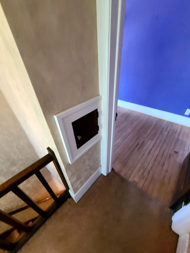 interior space with carpet flooring and baseboards