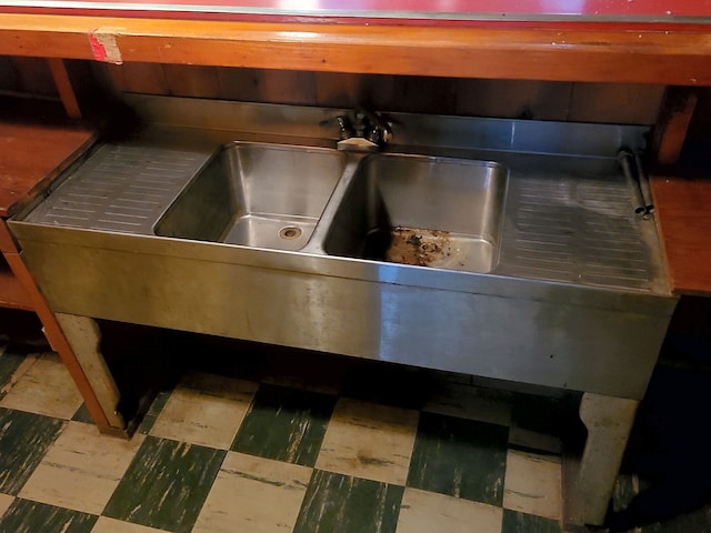 details with stainless steel counters and tile patterned floors