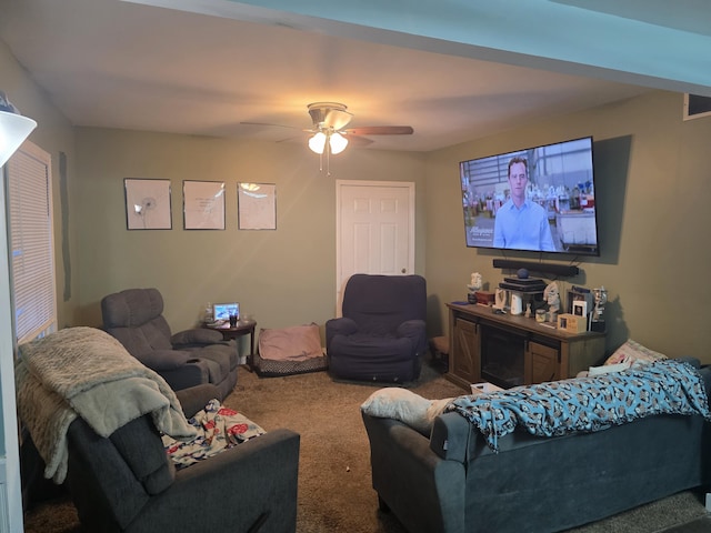 living room with a ceiling fan and carpet floors