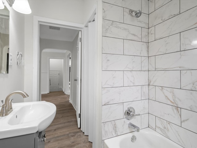 22625 Oaklane St, Warren, MI 48089 - full bathroom with visible vents, tub / shower combination, wood finished floors, and vanity