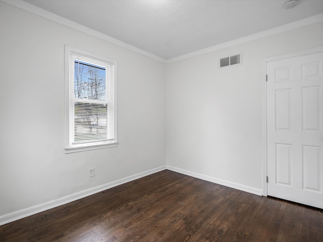 22625 Oaklane St, Warren, MI 48089 - unfurnished room featuring baseboards, visible vents, ornamental molding, and dark wood-type flooring