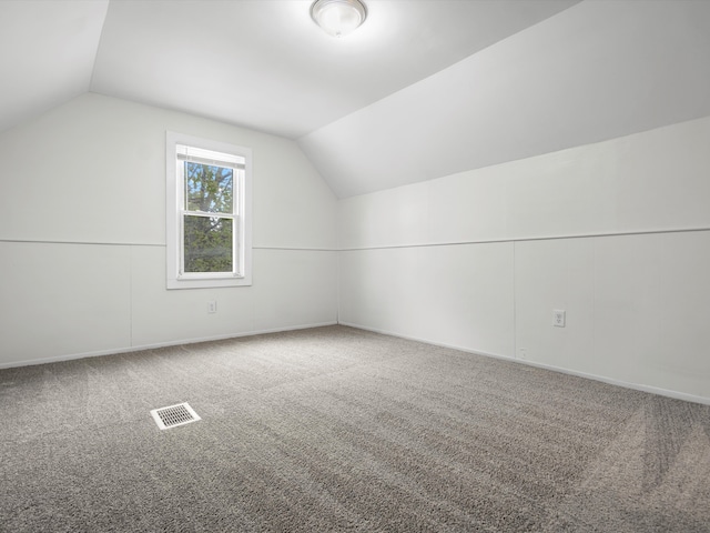 22625 Oaklane St, Warren, MI 48089 - additional living space featuring baseboards, carpet, vaulted ceiling, and visible vents