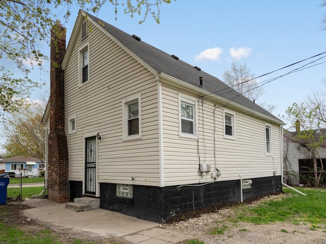 22625 Oaklane St, Warren, MI 48089 - view of side of home featuring a chimney