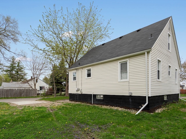 22625 Oaklane St, Warren, MI 48089 - view of property exterior with a lawn, fence, and roof with shingles