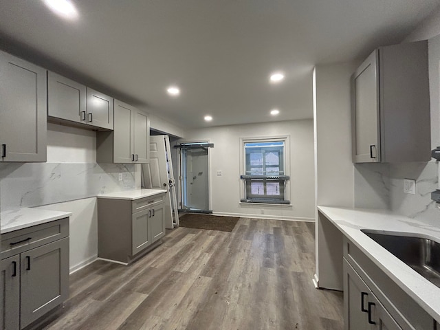 17639 Lenore, Detroit, MI 48219 - kitchen featuring recessed lighting, gray cabinets, tasteful backsplash, light stone counters, and dark wood finished floors