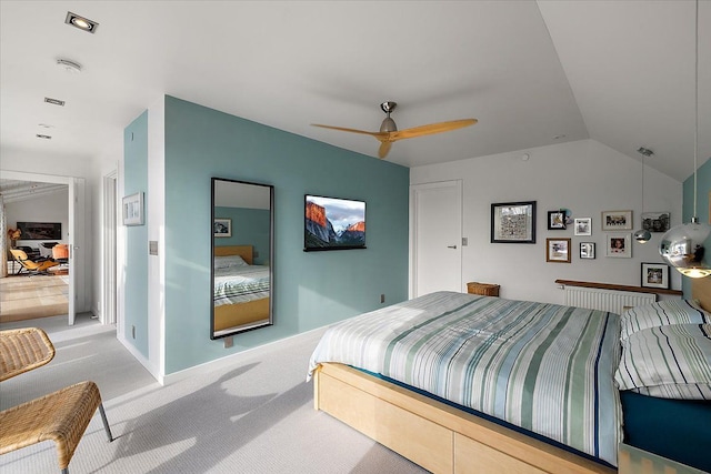 bedroom with carpet flooring, ceiling fan, and lofted ceiling
