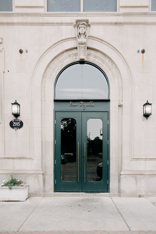 view of exterior entry featuring french doors