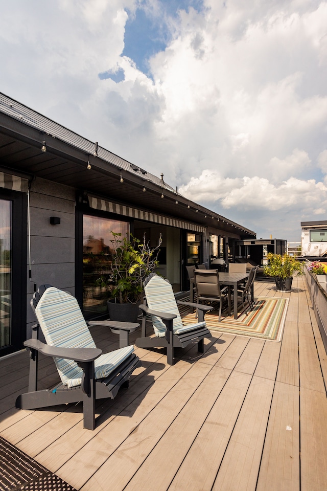 wooden deck with outdoor dining space