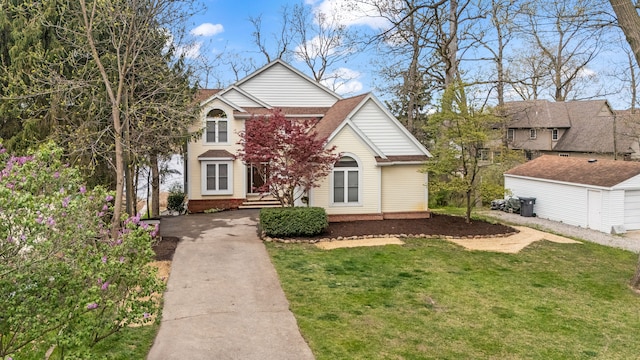 5027 Grover Dr, Brighton, MI 48116 - traditional-style house with a shingled roof, concrete driveway, and a front yard