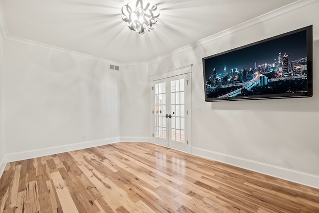 5027 Grover Dr, Brighton, MI 48116 - empty room with french doors, wood finished floors, visible vents, baseboards, and ornamental molding