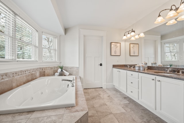 5027 Grover Dr, Brighton, MI 48116 - full bathroom with a sink, a chandelier, and a healthy amount of sunlight