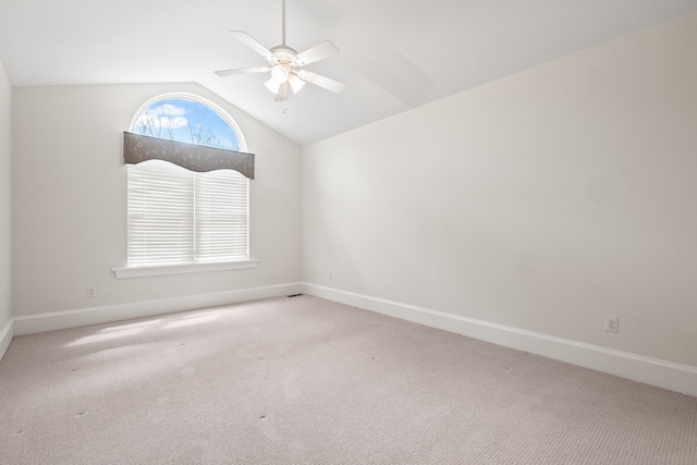 5027 Grover Dr, Brighton, MI 48116 - spare room featuring vaulted ceiling, carpet floors, baseboards, and a ceiling fan