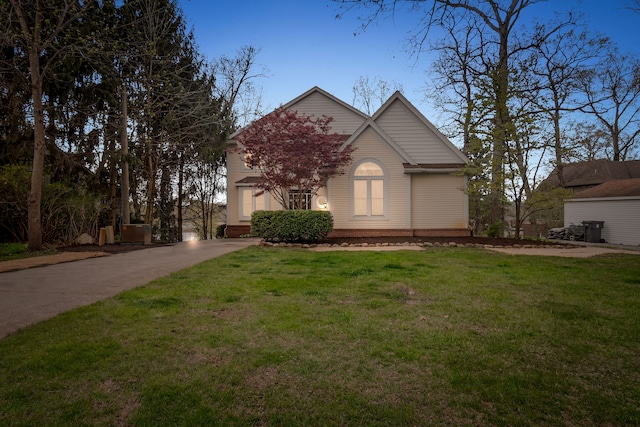 5027 Grover Dr, Brighton, MI 48116 - view of front of house featuring a front lawn