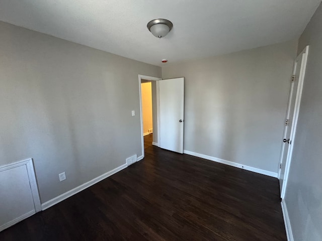 21260 Kipling St, Oak Park, MI 48237 - empty room featuring dark wood finished floors and baseboards