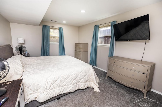 bedroom featuring visible vents, carpet, baseboards, and multiple windows