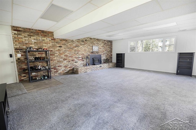 411 Rollcrest Ct, Midland, MI 48640 - unfurnished living room featuring a wood stove, carpet, and a paneled ceiling