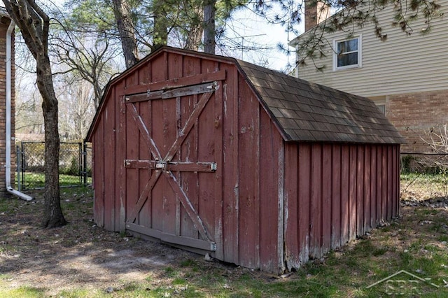 view of shed with fence