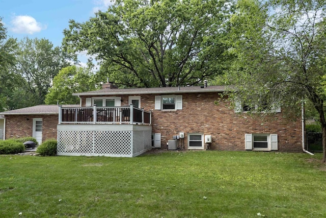 411 Rollcrest Ct, Midland, MI 48640 - rear view of house featuring brick siding, a lawn, a wooden deck, and a chimney