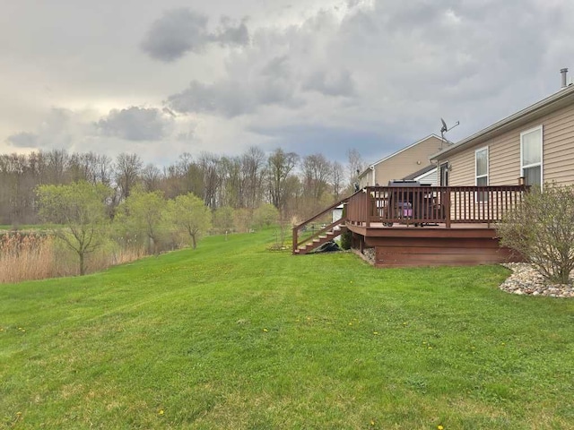 view of yard with a wooden deck