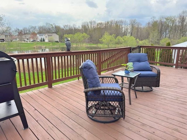 deck featuring a water view