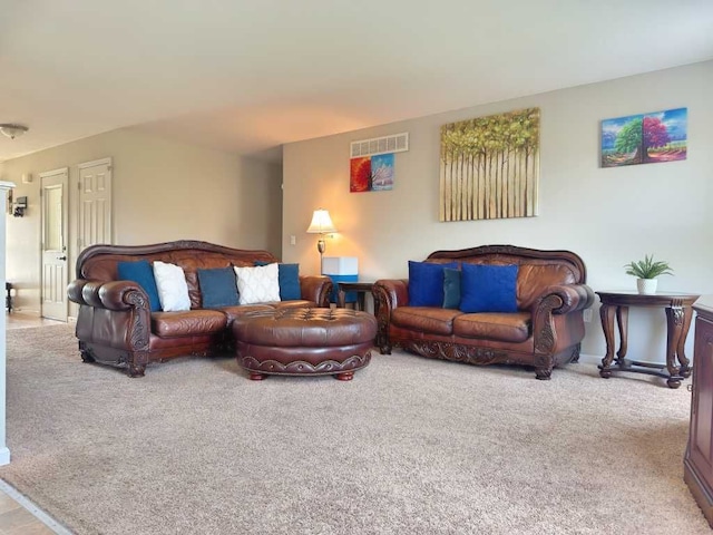 carpeted living area with visible vents