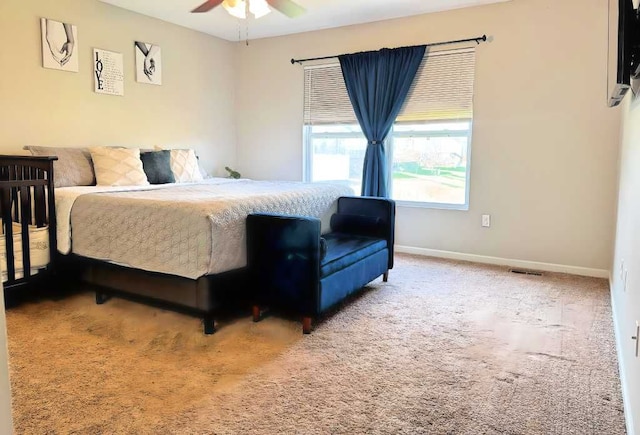 bedroom featuring carpet floors, a ceiling fan, baseboards, and visible vents