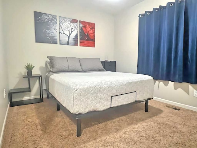 bedroom featuring carpet flooring, baseboards, and visible vents
