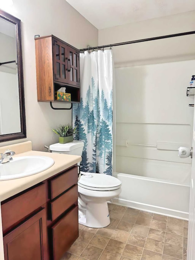full bath with vanity, toilet, and shower / tub combo