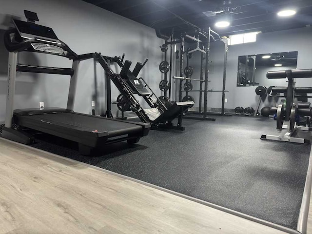 exercise room with wood finished floors